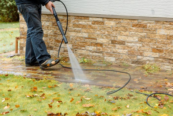 man-cleaning-street-with-high-pressure-power-washer-washing-stone-garden-paths1 man-cleaning-street-with-high-pressure-power-washer-washing-stone-garden-paths1