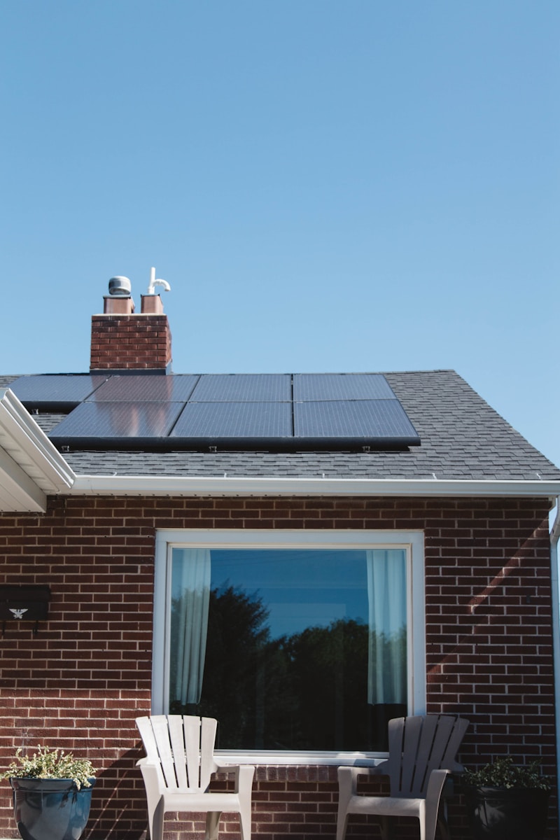 Photo by Vivint Solar brown brick house with solar panels on roof
